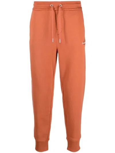 Calvin Klein Jeans Est.1978 Logo-embroidered Track Pants In Orange
