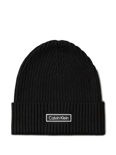 Calvin Klein Logo-patch Ribbed Beanie In Black