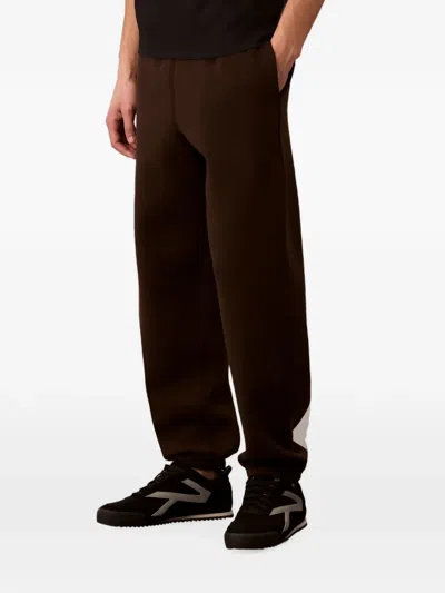 Calvin Klein Logo-print Elasticated-waist Track Pants In Brown