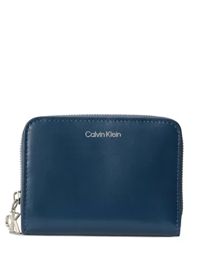 Calvin Klein Monogram-charm Leather Wallet In Blue