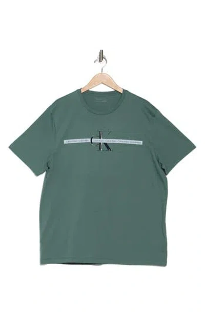 Calvin Klein Repeat Tape Layer Logo Graphic T-shirt In Dark Forest