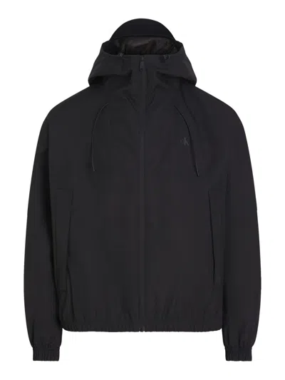 CALVIN KLEIN CALVIN KLEIN WATERPROOF BLACK DRAWSTRING HOOD JACKET WITH MULTIPLE POCKETS