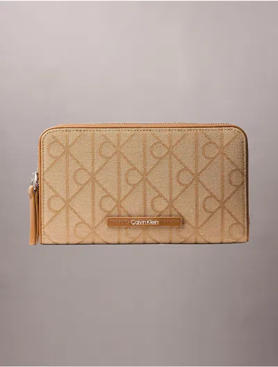 Calvin Klein Women's Allover Emblem Logo Passport Wallet In Yellow