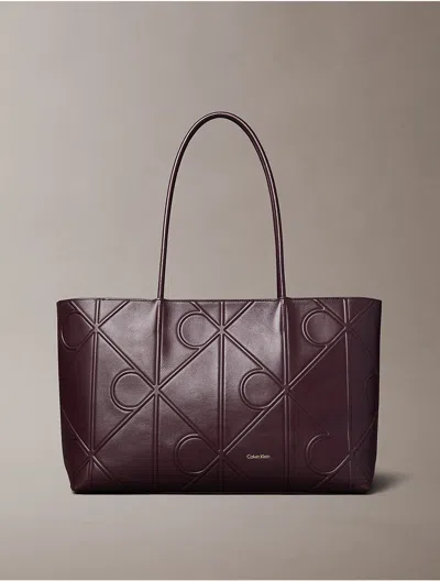 Calvin Klein Women's Embossed Allover Monogram Logo Tote Bag In Brown
