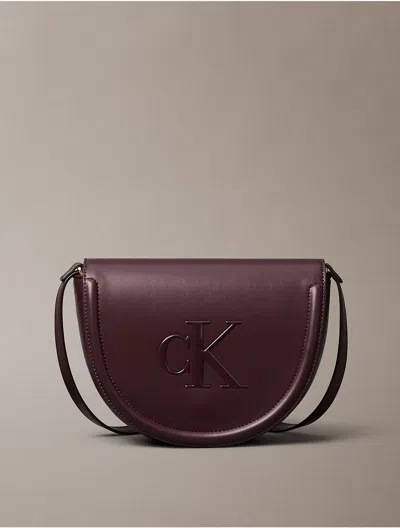 Calvin Klein Women's Embossed Monogram Logo Saddle Bag In Brown