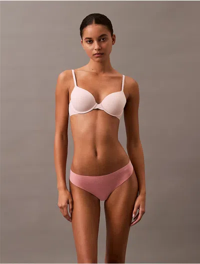Calvin Klein Women's Invisibles Thong In Luminous Peach