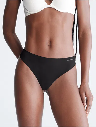Calvin Klein Women's Invisibles Thong In Ck Black