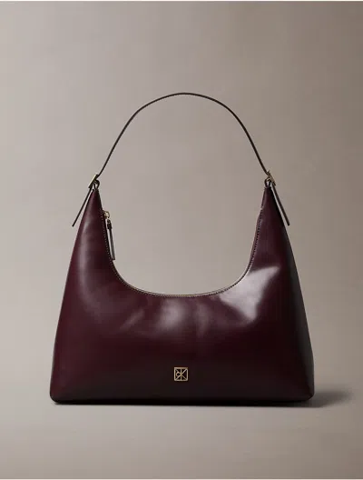 Calvin Klein Women's Monogram Logo Emblem Leather Shoulder Bag In Brown