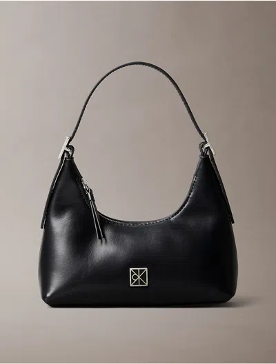 Calvin Klein Women's Monogram Logo Emblem Leather Small Shoulder Bag In Black