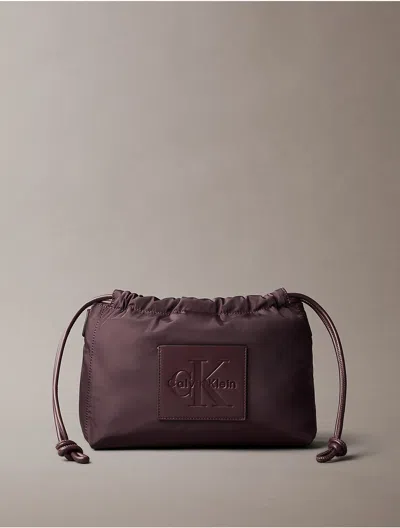 Calvin Klein Women's Nylon Drawstring Monologo Crossbody Bag In Fudge