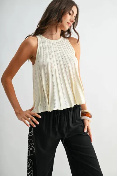 Camellia Sleeveless Knit Top With Flared Hem In Cream In White
