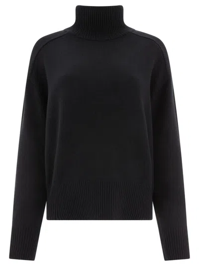 CANADA GOOSE COZY AND CHIC: LUXURIOUS BLACK TURTLENECK SWEATER FOR WOMEN