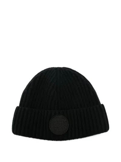 Canada Goose Logo-patch Ribbed Beanie Hat In Black
