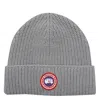 Canada Goose Logo-patch Ribbed Beanie In Gray