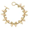 Canvas Style Women's Bow Linked Toggle Bracelet In Worn Gold In Gold