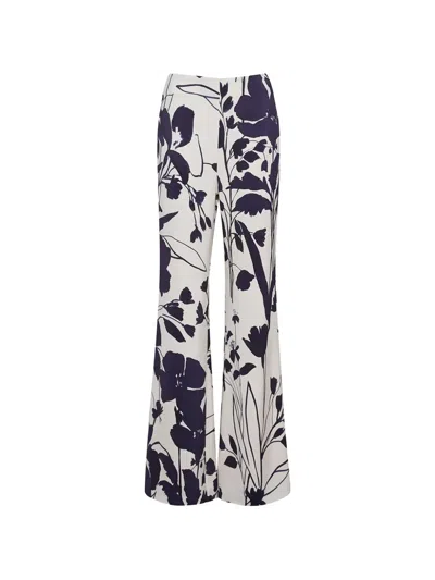 Cara Cara Pisa Floral-print Trousers In Black