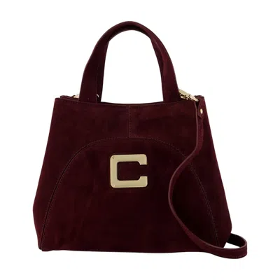 Carel Clem Top Handle Bag In Burgundy