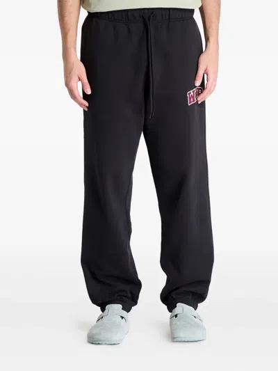 CARHARTT LOGO-PATCH TRACK PANTS