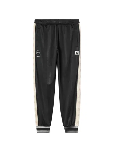 Carhartt Logo-stripe Ribbed-cuff Track Pants In Black