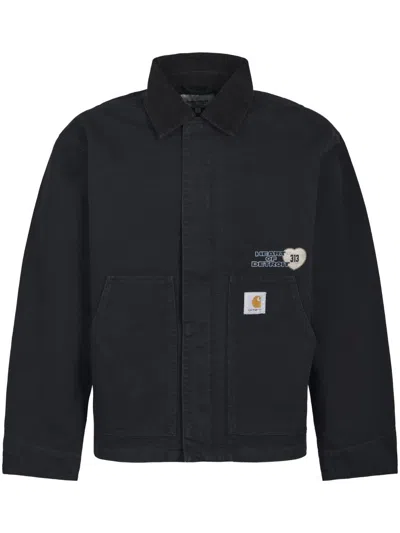 CARHARTT TEXTURED BLACK CANVAS JACKET WITH BOLD GRAPHIC PRINT