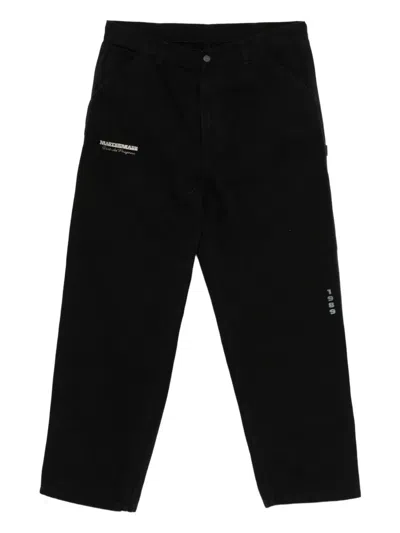 Carhartt Wip Og Single Knee Graphic Trousers In Black