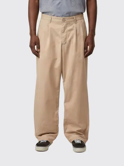 Carhartt Wip Pants Men In Gold