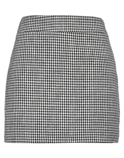 Carla G. Mini Skirts In Black