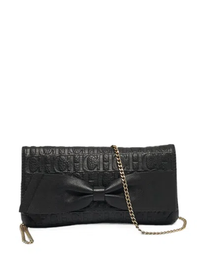 Pre-owned Carolina Herrera Vintage Monogram-embossed Bow Shoulder Bag In Black