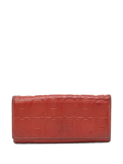 Pre-owned Carolina Herrera Vintage Monogram-embossed Wallet In Orange