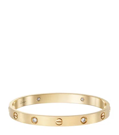 Cartier Yellow Gold And Diamond Brushed Love Bangle In Red