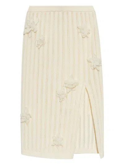 CASABLANCA CASABLANCA KNEE-LENGTH RIBBED SKIRT WITH FLORAL APPLIQUÉS AND SIDE SLIT