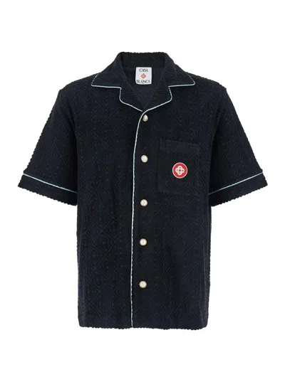 CASABLANCA BLACK SHIRT WITH CLASSIC LAPELS AND ALL-OVER EMBOSSED MONOGRAM IN COTTON MAN