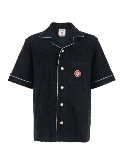 CASABLANCA BLACK SHIRT WITH CLASSIC LAPELS AND ALL-OVER EMBOSSED MONOGRAM IN COTTON MAN