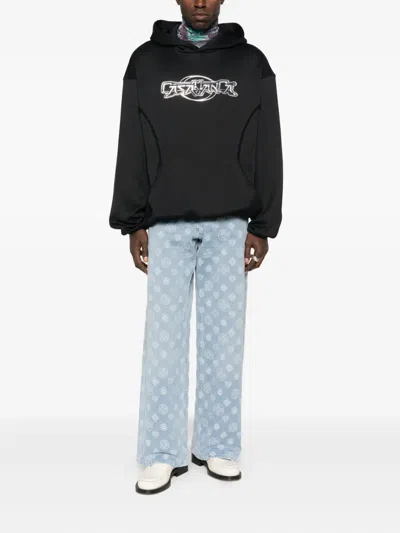 CASABLANCA MONOGRAM-PATTERN JEANS