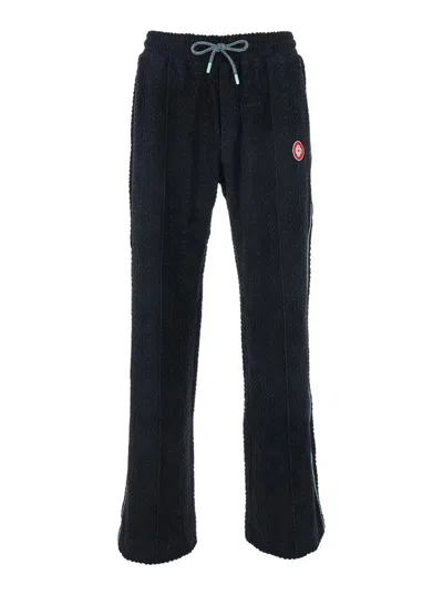 CASABLANCA BLACK PANTS WITH ALL-OVER EMBOSSED MONOGRAM AND DRAWSTRING WAIST IN COTTON MAN