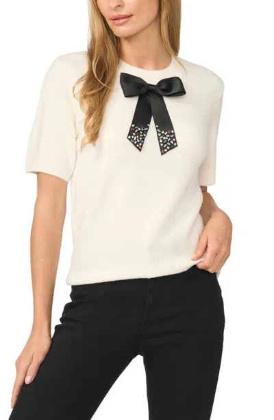 Cece Bow Embellished Short Sleeve Sweater In White