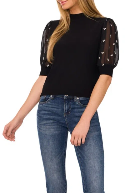 Cece Mixed Media Puff Sleeve Mock Neck Top In Rich Black