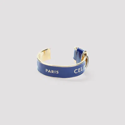 Celine Knotted Cuff Bracelet In Brass With Enamel Detail In Blue