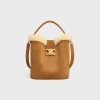 Celine Medium Louise Bucket Bag With Shearling Trim In Brown