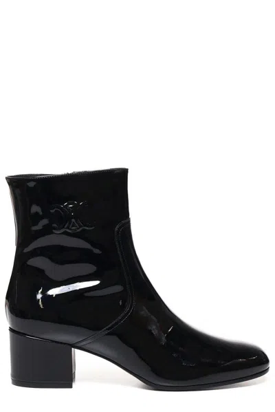 Celine Women Patent Leather Boots With Engraved Triomphe Logo In Black