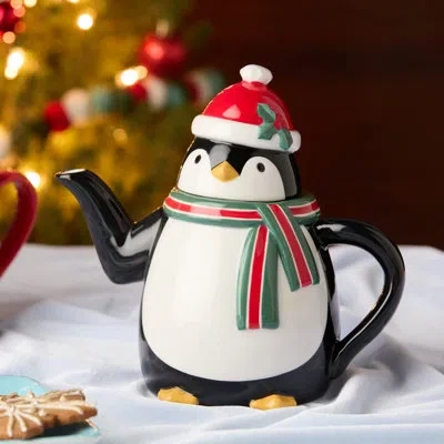 Certified International Christmas Whimsy Penguin 3d Teapot, 26 oz Ceramic Holiday Teapot With Santa Hat & Scarf, Festive Win In Black;white;green;red;yellow