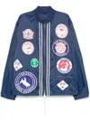 Champion Drawstring Hem Bomber With Elastic Cuffs And Patches In Blue