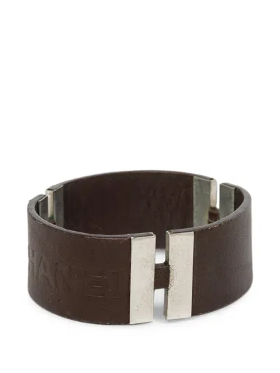 Pre-owned Chanel 2000 Debossed Leather And Brass Logo Cuff Bracelet Costume Bracelet In Brown