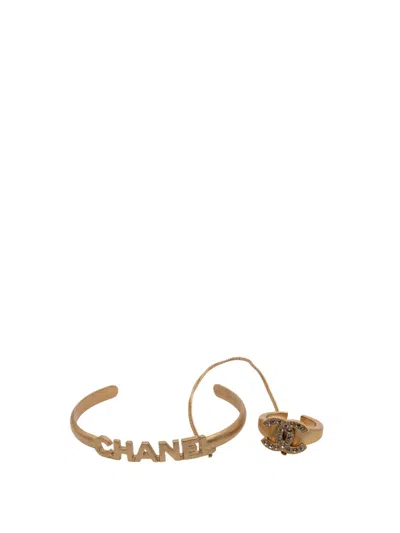 Pre-owned Chanel 2001 Gold Plated Cc Rhinestone And Logo Cuff Bracelet And Ring Set Costume Bracelet