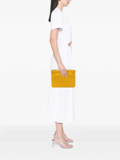 Pre-owned Chanel 2018 Medium Quilted Caviar O Case Clutch Bag In Yellow