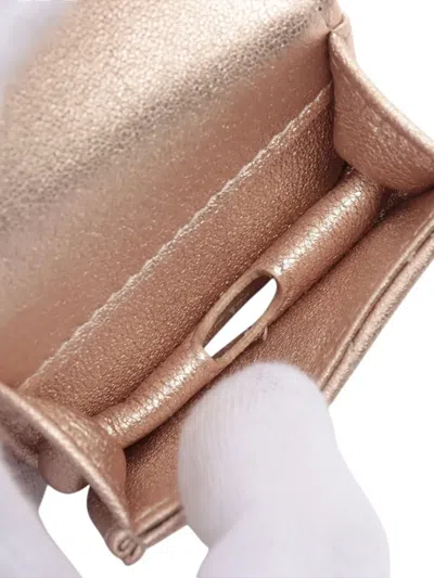 Pre-owned Chanel 2021-2025 Quilted Metallic Lambskin Round Clip On Coin Purse And Airpods Case In Gold