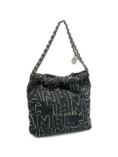 Chanel 22 Logo-patchwork Shoulder Bag In Black