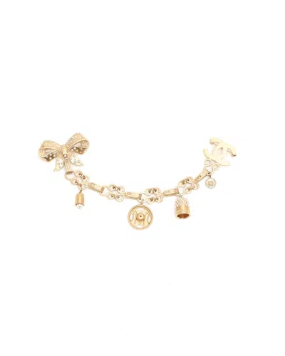 Chanel Cc Pearl Ribbon Chain Brooch In Gold
