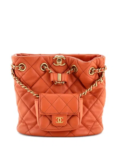 Pre-owned Chanel Cc Pocket Chain Bucket Quilted Lambskin Small Backpack In Orange
