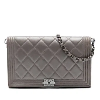 Pre-owned Chanel Lambskin Quilted Metallic Lambskin Boy Clutch On Chain In Brown